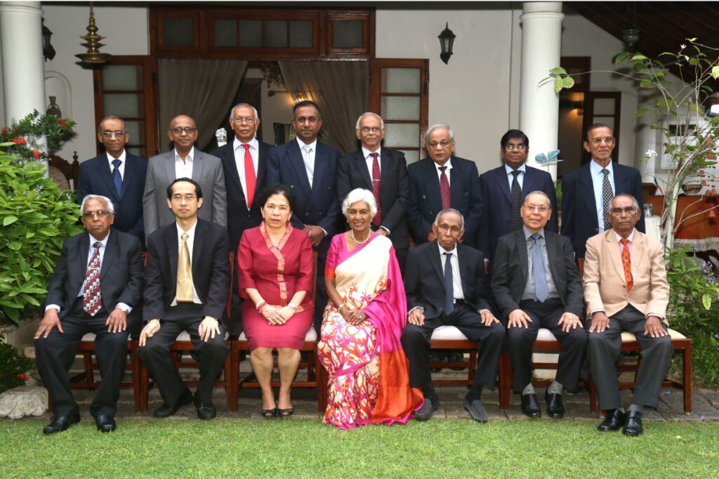 Members and guests photographed outdoors at a Society reception