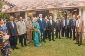 Members and guests photographed on the lawn at a Society reception