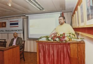 A speaker addressing the audience from the podium at a Society event