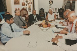 Committee members in session around the meeting table