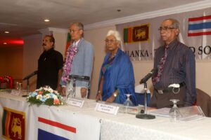 A guest of honour being garlanded at a Sri Lanka-Thailand Society event