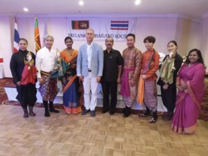 Participants in traditional Thai and Sri Lankan dress at a cultural event