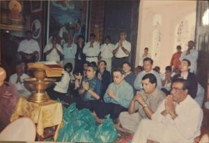 Archive photograph of a temple almsgiving attended by Society members