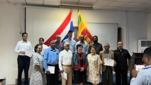 Participants holding their certificates at a Society presentation