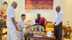 A certificate being presented to a Buddhist monk during a temple ceremony