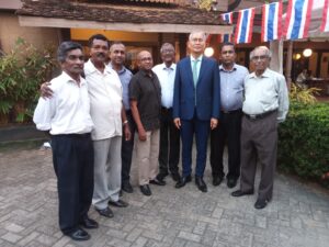 Society members with a visiting guest at an outdoor event