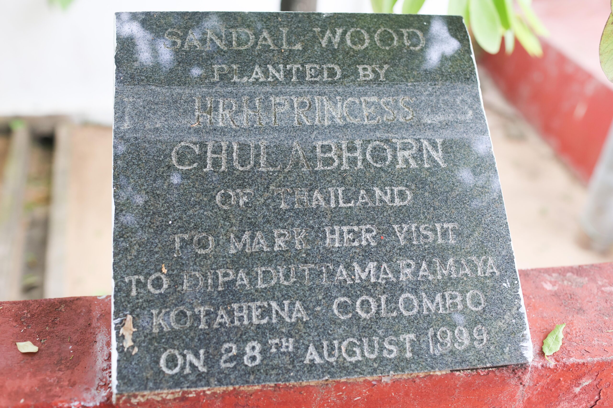 Sandalwood plaque commemorating Princess Chulabhorn’s visit to Dipaduttaramaya