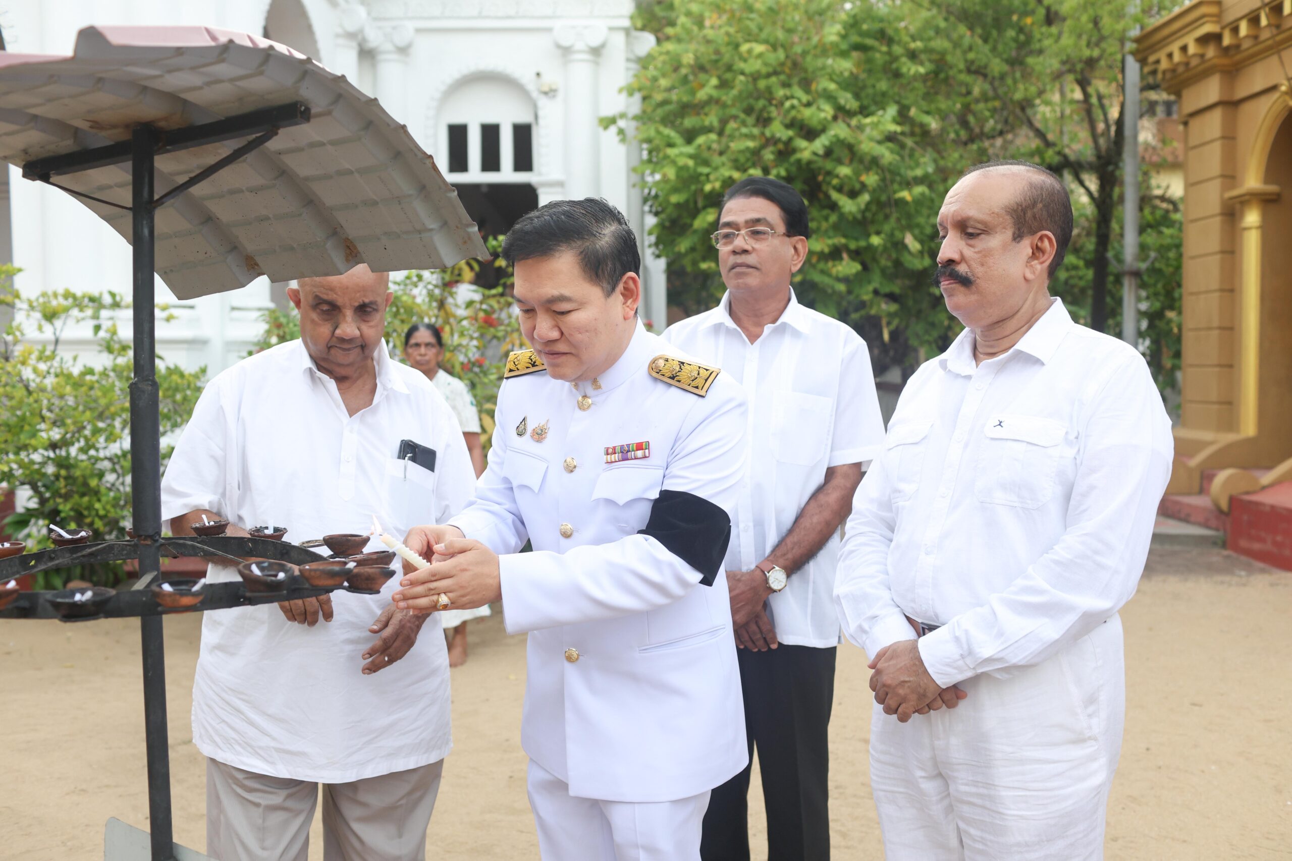 Lighting oil lamps during the commemorative ceremony